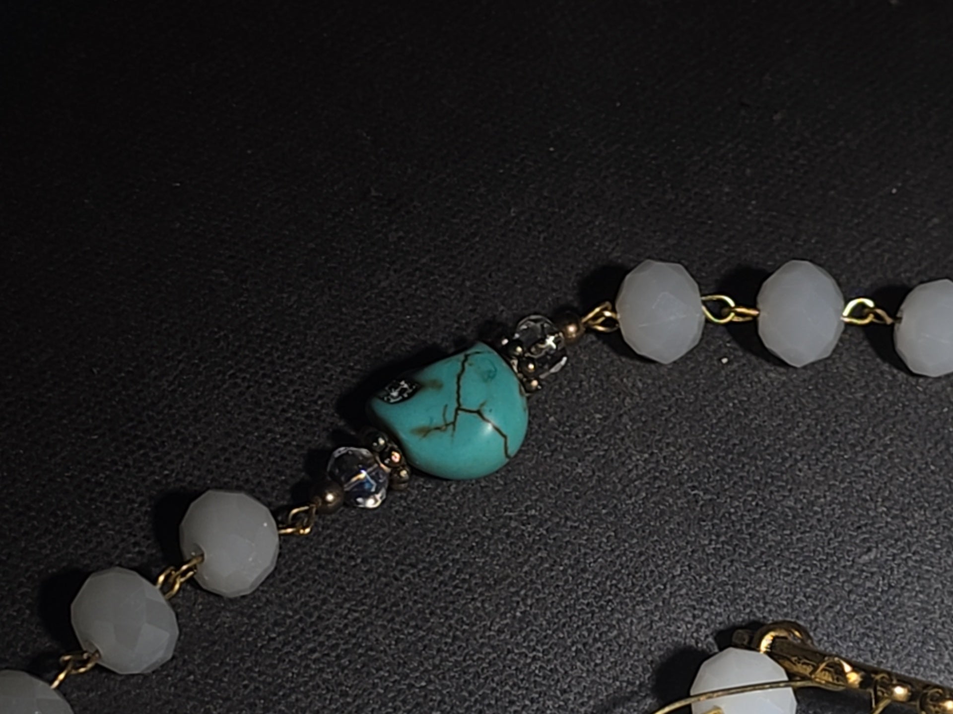 Vintage Beaded Rosary Necklace with Turquoise Skull Beads, Cross Pendant, and Gold-Plated Fringe Elements