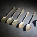 Lot 015 - Grouping of Including Four Sterling Silver Spoons (92 g Total Weight), an 800 Silver Spoon (28 g), and German Silver Chatelaine Accessory