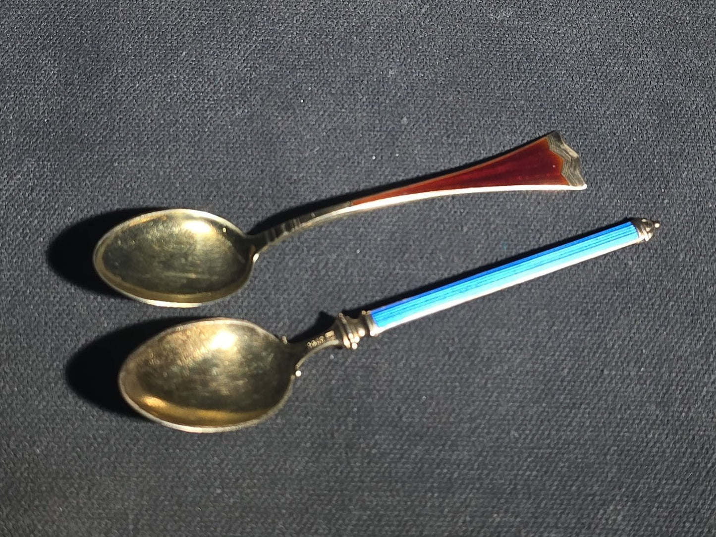 Grouping of 24 Antique and Vintage Sterling, 800 Silver, and Silver-Plated Souvenir and Collector's Spoons and Cutlery including 23 Spoons and One Fork