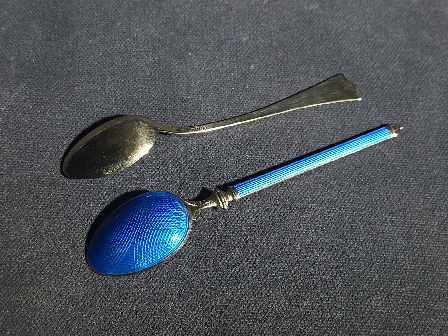 Grouping of 24 Antique and Vintage Sterling, 800 Silver, and Silver-Plated Souvenir and Collector's Spoons and Cutlery including 23 Spoons and One Fork