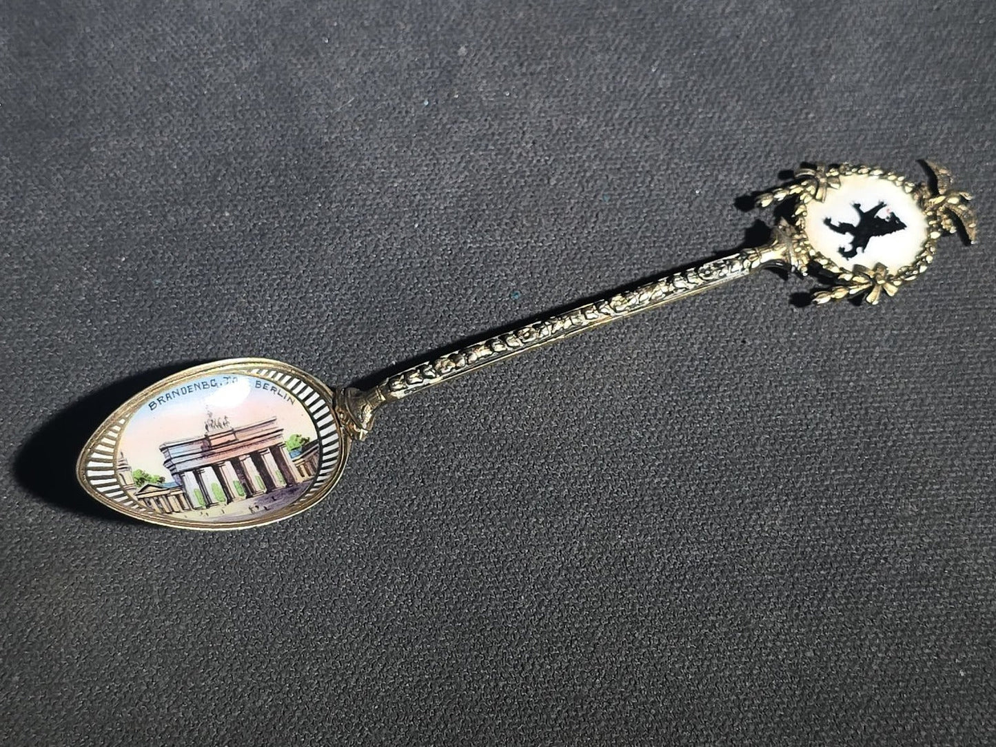 Grouping of 24 Antique and Vintage Sterling, 800 Silver, and Silver-Plated Souvenir and Collector's Spoons and Cutlery including 23 Spoons and One Fork