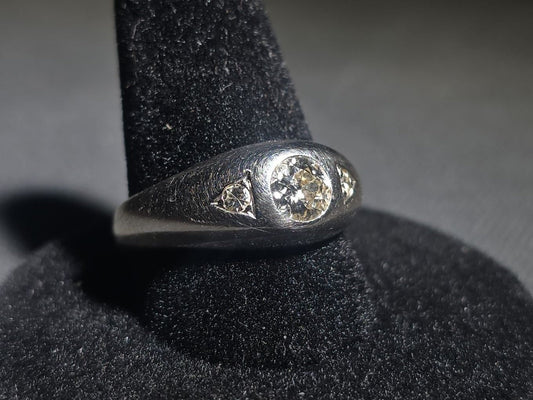 14K White Gold Three-Stone Diamond Ring with Flush-Set Center Stone and Triangular Side Settings