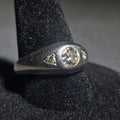 Lot 018 - 14k White Gold Three-Stone Diamond Ring with Flush-Set Center Stone and Triangular Side Settings, Size 9, Total Weight 5.59 g