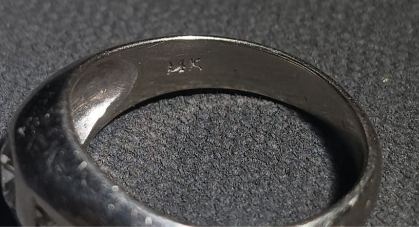 14K White Gold Three-Stone Diamond Ring with Flush-Set Center Stone and Triangular Side Settings