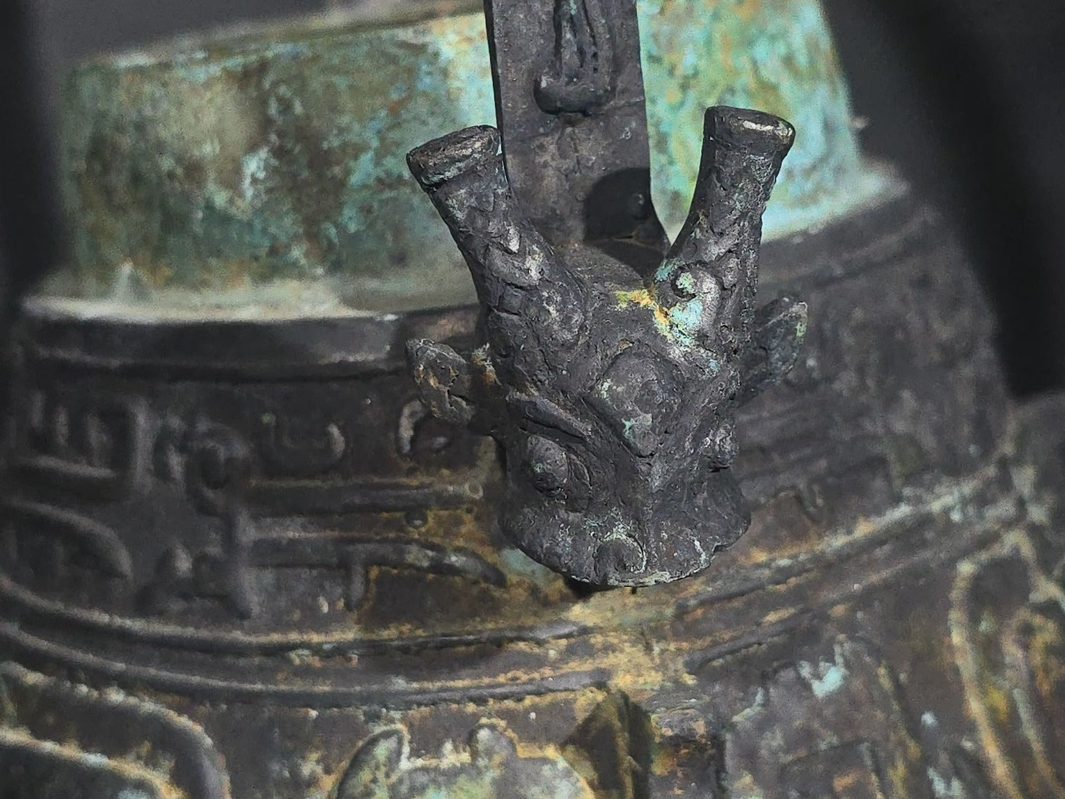 Antique Chinese Bronze You Vessel Reproduction with Taotie Mask Decoration, Swing Bail Handle, and Lidded Top