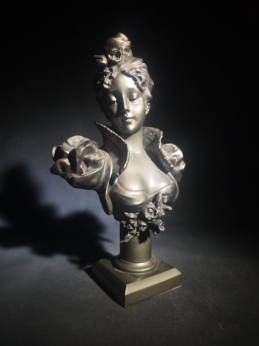 Vintage Art Nouveau Style Bust of a Young Woman with Upswept Hair, Ruffled Collar, and Rose Spray on Pedestal Base