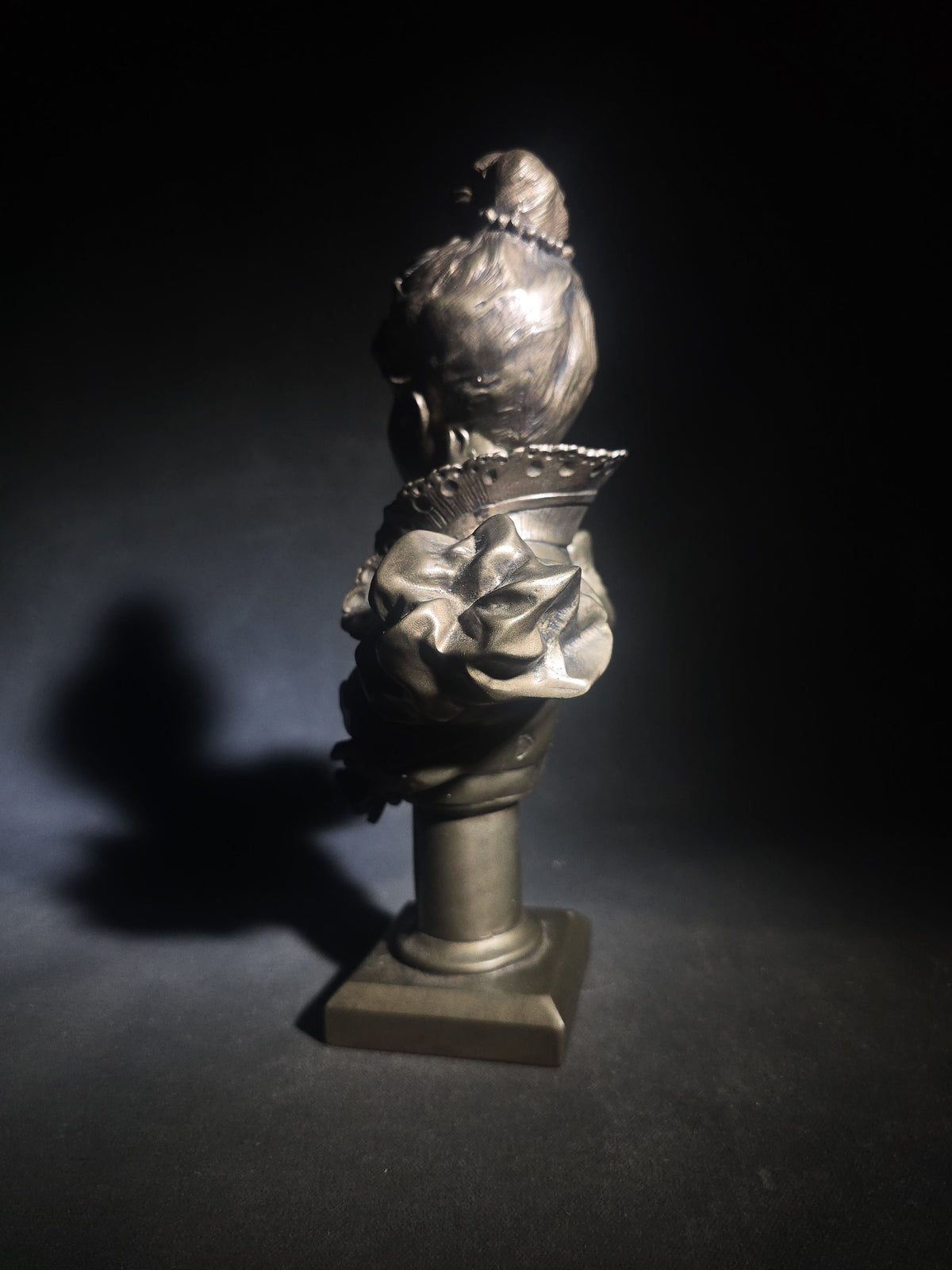 Vintage Art Nouveau Style Bust of a Young Woman with Upswept Hair, Ruffled Collar, and Rose Spray on Pedestal Base
