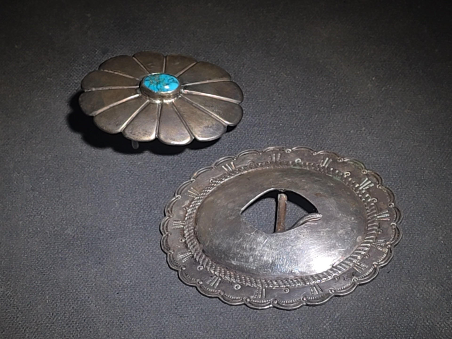 Pair of Vintage Southwestern Sterling Silver Belt Buckles including Turquoise-Set Petal Form and Stamped Oval Concho