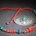 Lot 084 - Pair of Vintage Southwestern Jewelry Items Including Coral and Turquoise Bead Necklace and Stamped Metal Thunderbird Brooch with Turquoise Cabochon