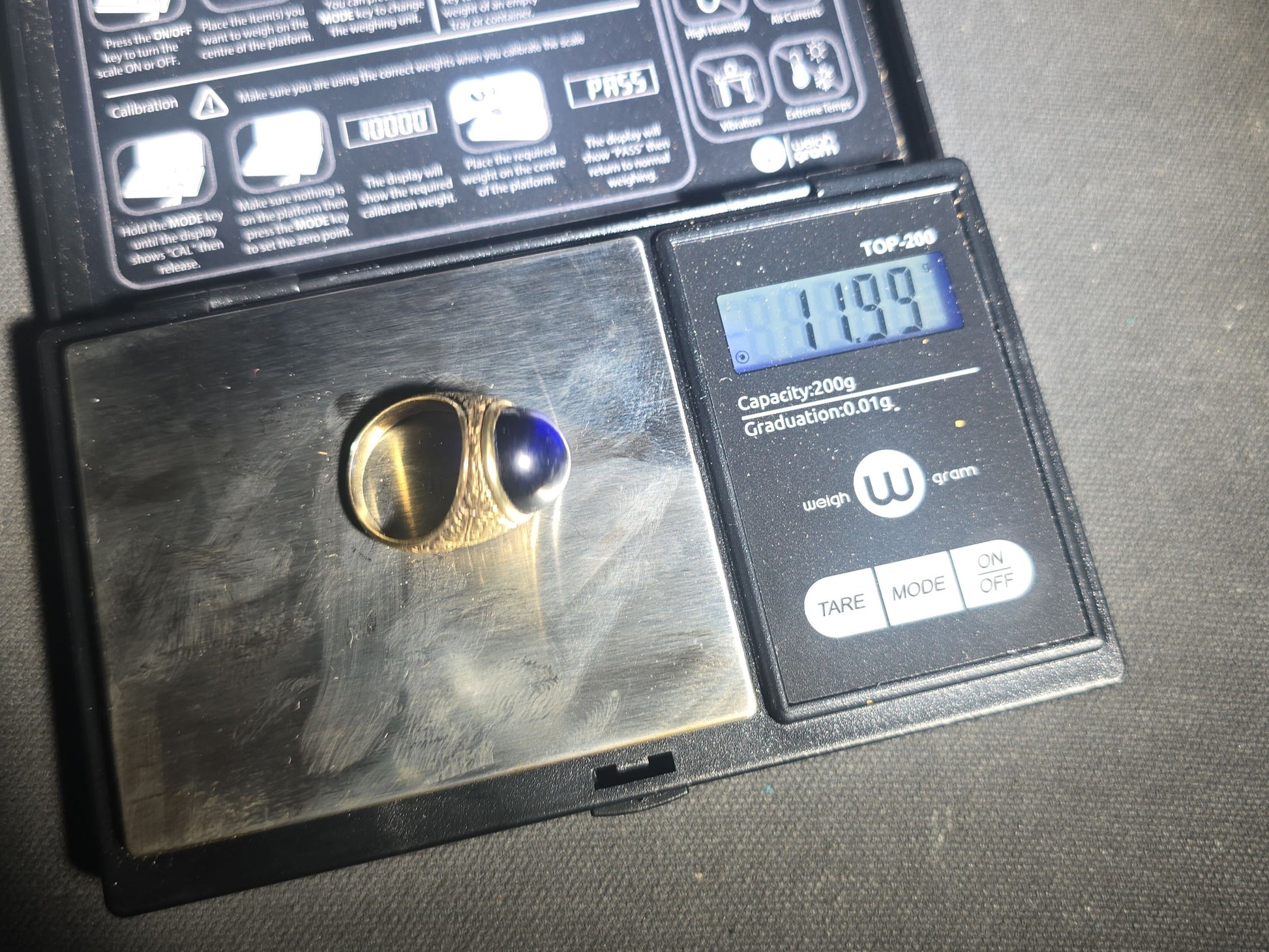 14K Gold Ring with Large Oval Cabochon Sapphire and Engraved Floral Scrollwork Band