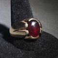 Lot 025 - 10k Gold Ring with Oval Cabochon Ruby and Angular Shoulders, Size 9, Total Weight 10.77 g