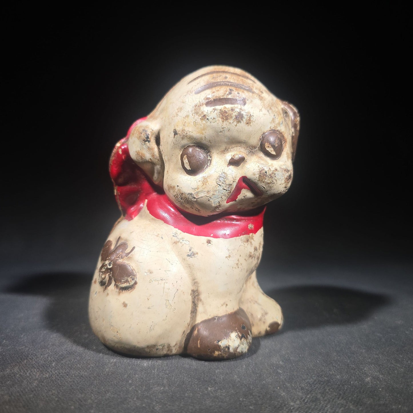 Vintage Hubley "Puppo" Painted Cast Iron Figural Puppy Still Bank with Red Bow and Bee Motif