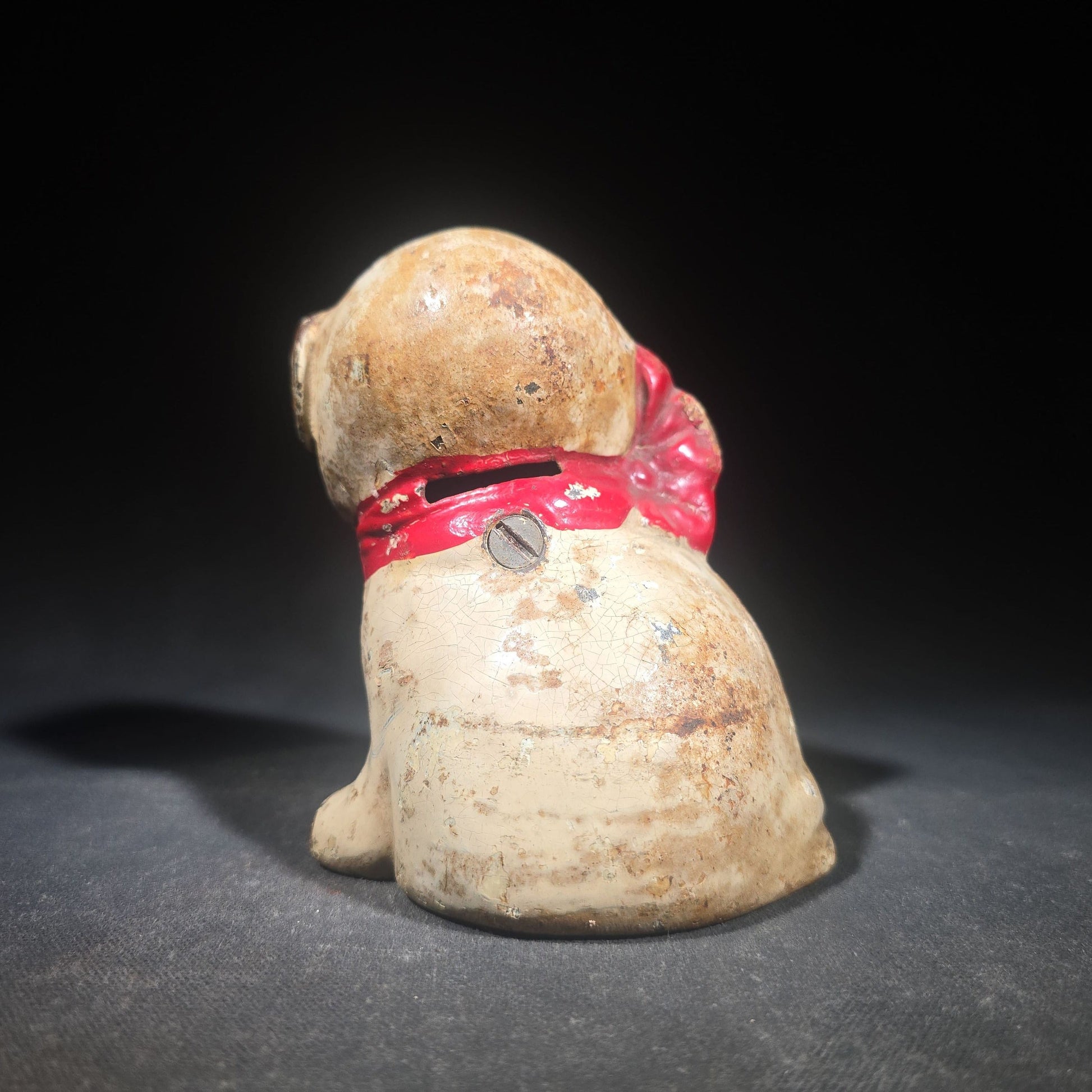 Vintage Hubley "Puppo" Painted Cast Iron Figural Puppy Still Bank with Red Bow and Bee Motif