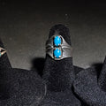 Lot 040 - Trio of Vintage Southwestern Sterling Silver and Turquoise Rings Including Two Matching Seven-Stone Cluster Flower Rings and a Two-Stone Oval Cabochon Ring, Total Weight 6.33 g