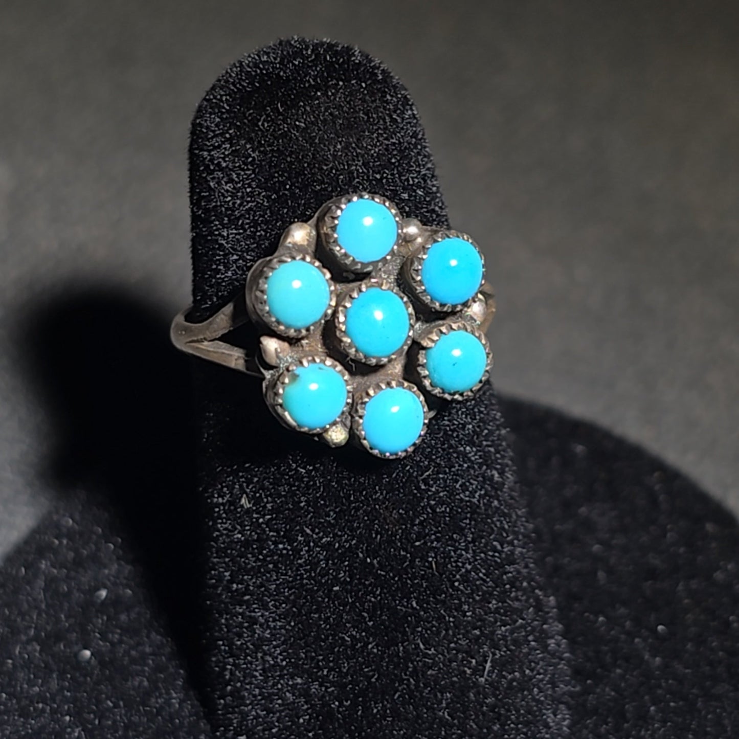 Trio of Vintage Southwestern Sterling Silver and Turquoise Rings Including Two Matching Seven-Stone Cluster Flower Rings and a Two-Stone Oval Cabochon Ring