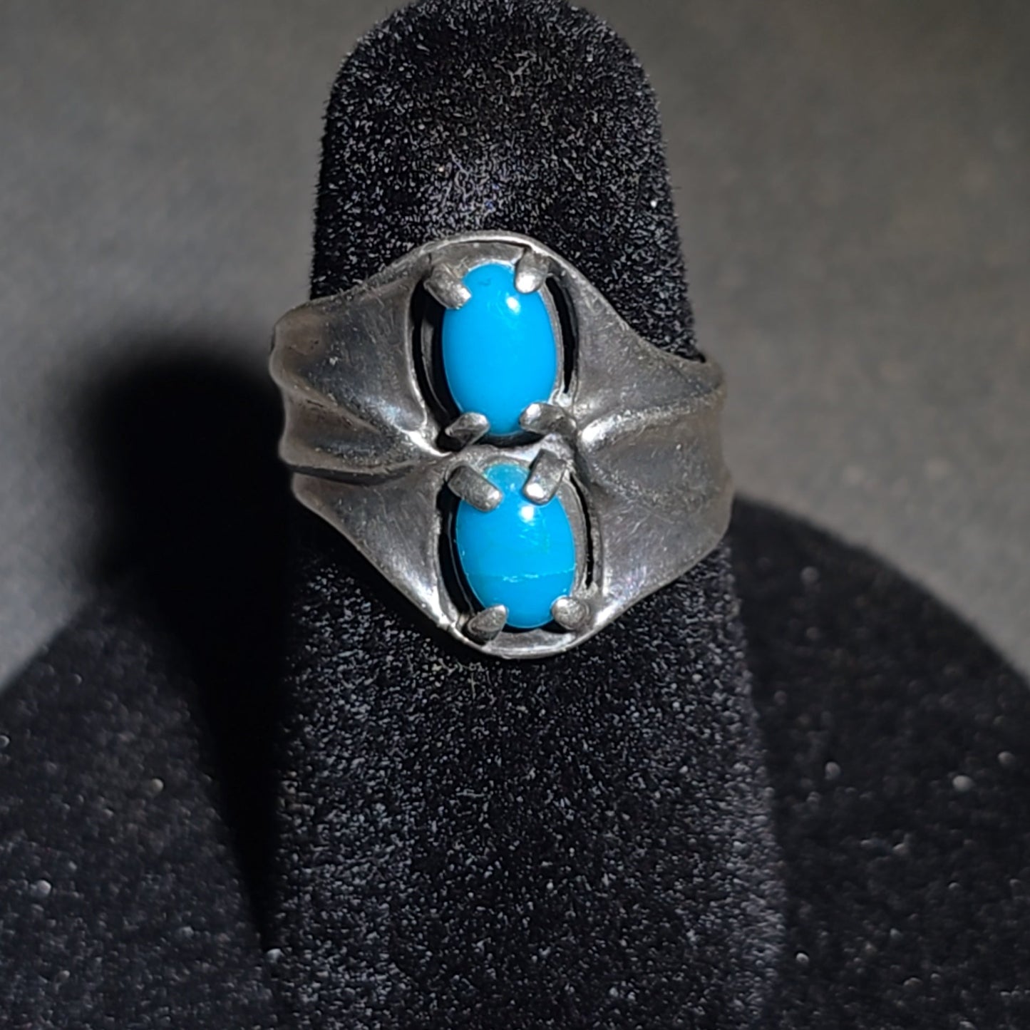 Trio of Vintage Southwestern Sterling Silver and Turquoise Rings Including Two Matching Seven-Stone Cluster Flower Rings and a Two-Stone Oval Cabochon Ring