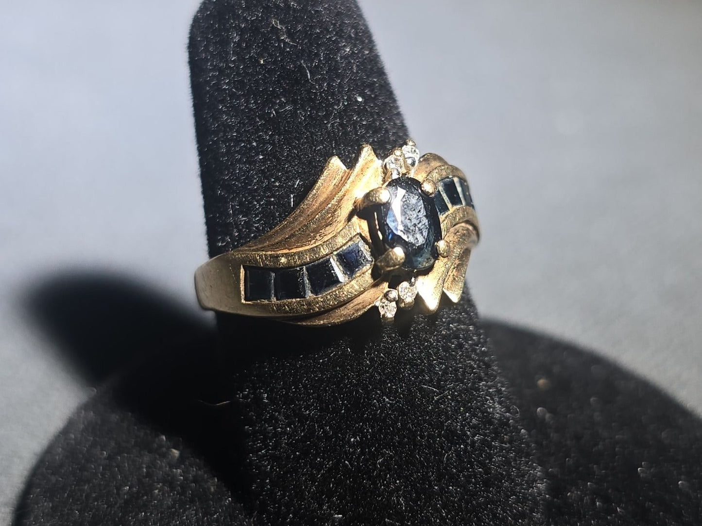 10K Gold Oval-Cut Sapphire and Diamond Bypass Ring with Channel-Set Sapphires
