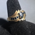 Lot 027 - 10k Gold Oval-Cut Sapphire and Diamond Bypass Ring with Channel-Set Sapphires, Size 6, Total Weight 3.71 g