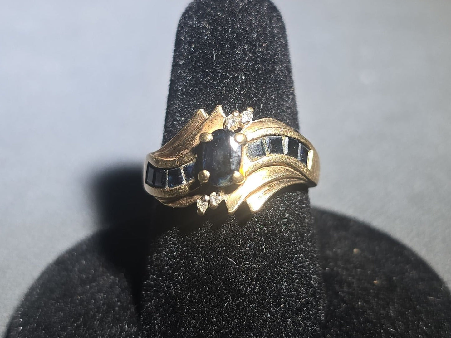 10K Gold Oval-Cut Sapphire and Diamond Bypass Ring with Channel-Set Sapphires