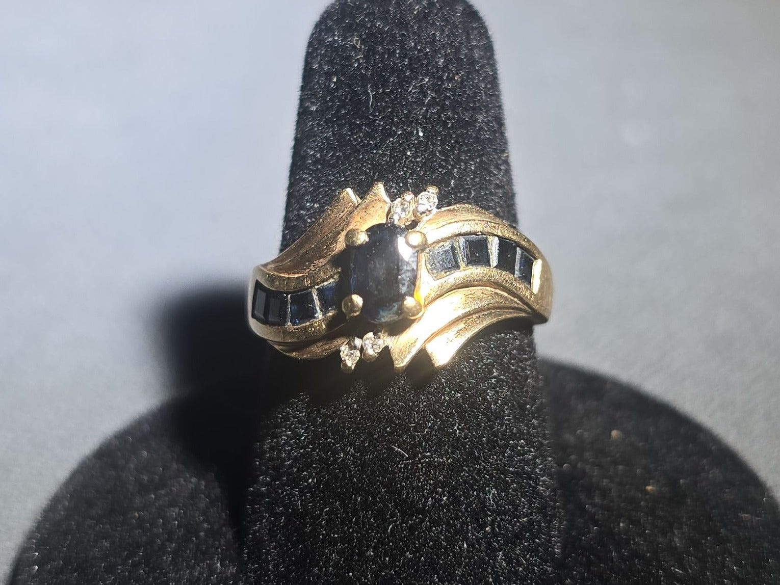 10K Gold Oval-Cut Sapphire and Diamond Bypass Ring with Channel-Set Sapphires