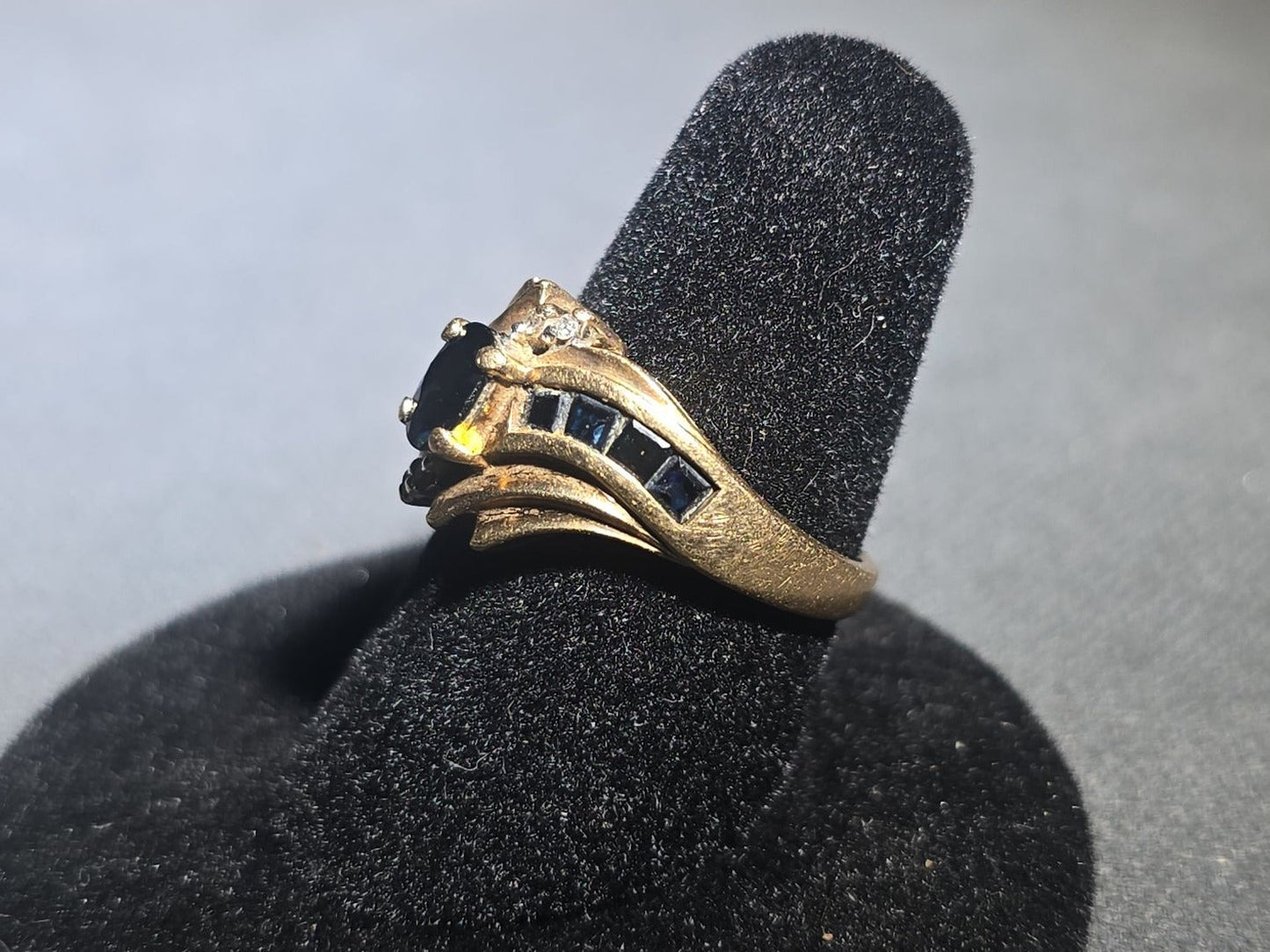 10K Gold Oval-Cut Sapphire and Diamond Bypass Ring with Channel-Set Sapphires