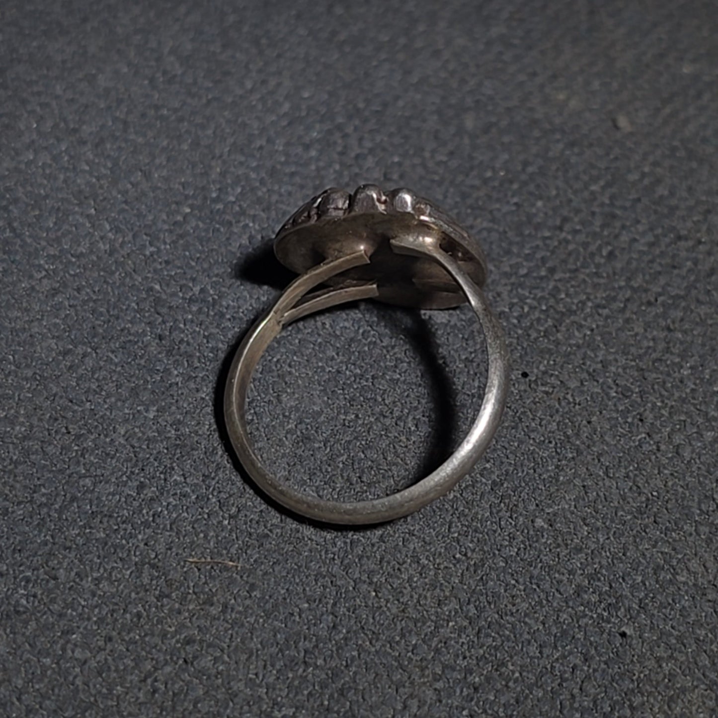 Grouping of Five Vintage Navajo Silver and Mother of Pearl Rings including a Four-Stone Ring by Les Hill, Sizes four through Seven