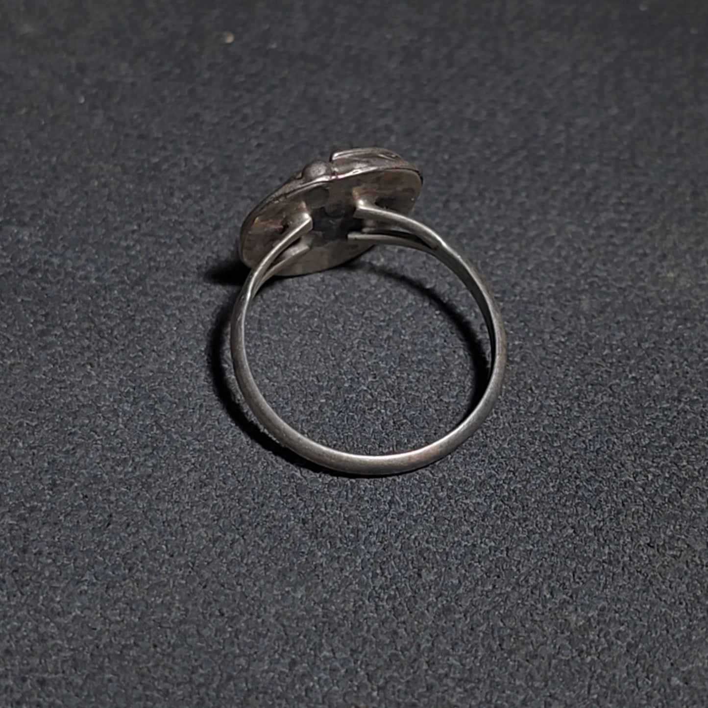 Grouping of Five Vintage Navajo Silver and Mother of Pearl Rings including a Four-Stone Ring by Les Hill, Sizes four through Seven