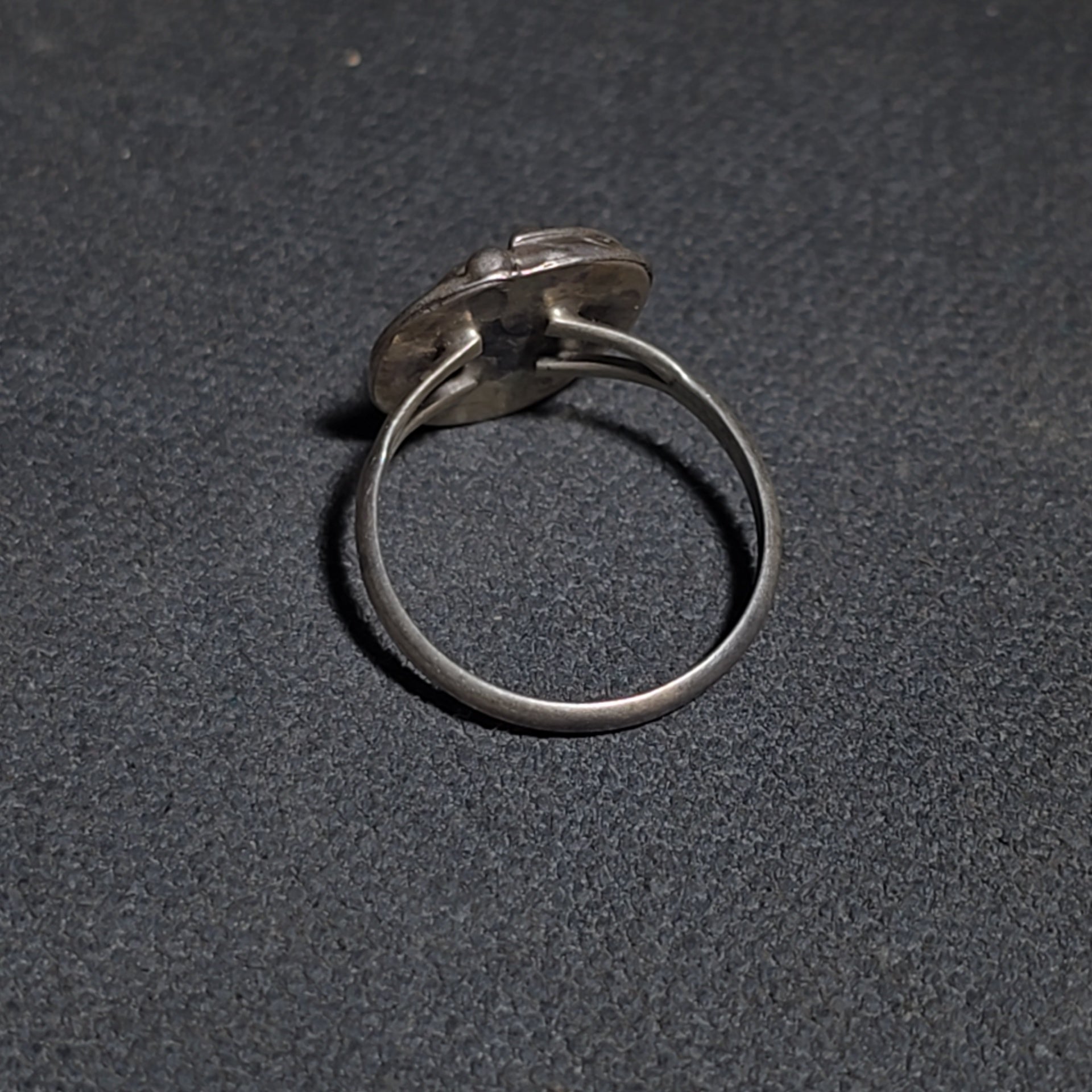 Grouping of Five Vintage Navajo Silver and Mother of Pearl Rings including a Four-Stone Ring by Les Hill, Sizes four through Seven