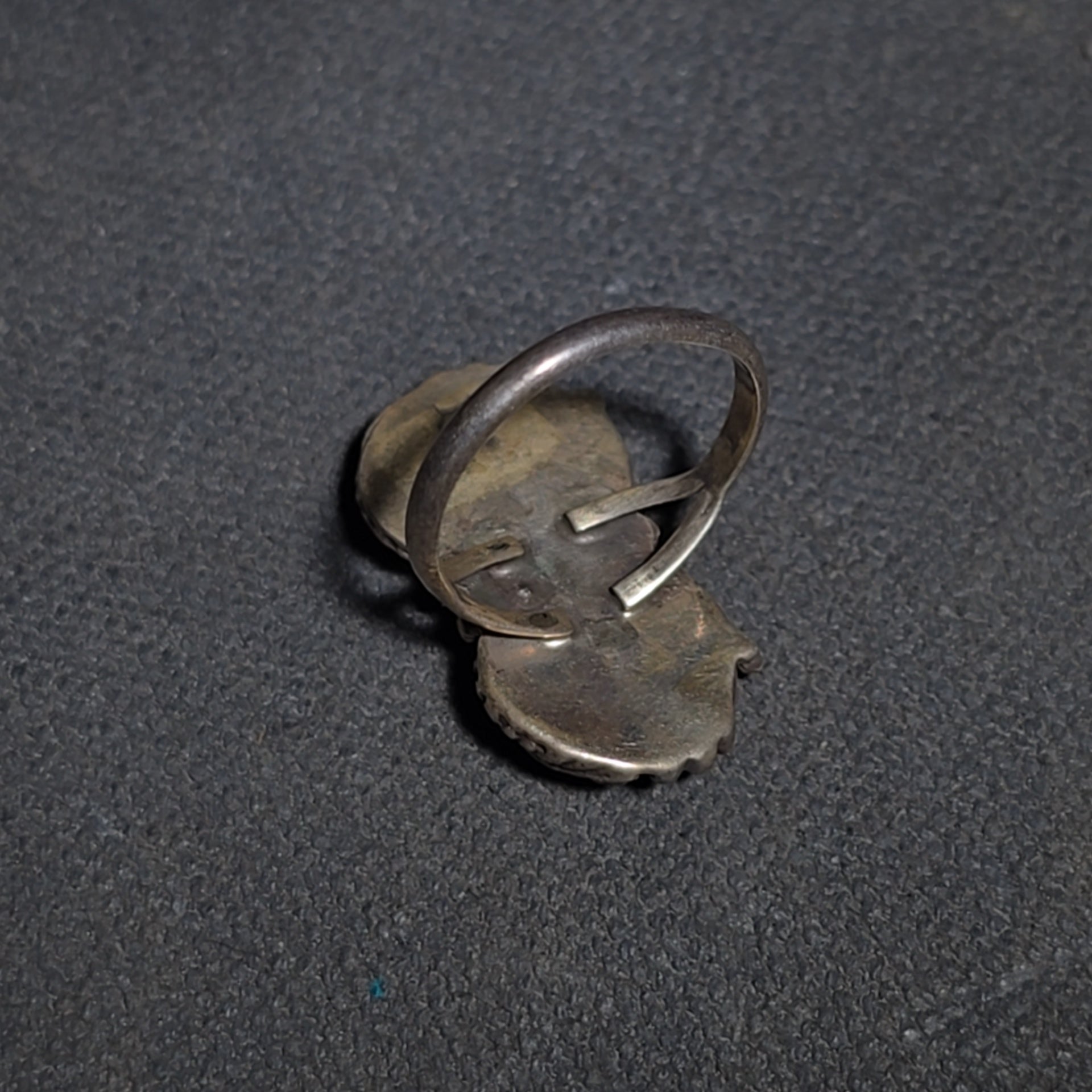 Grouping of Five Vintage Navajo Silver and Mother of Pearl Rings including a Four-Stone Ring by Les Hill, Sizes four through Seven