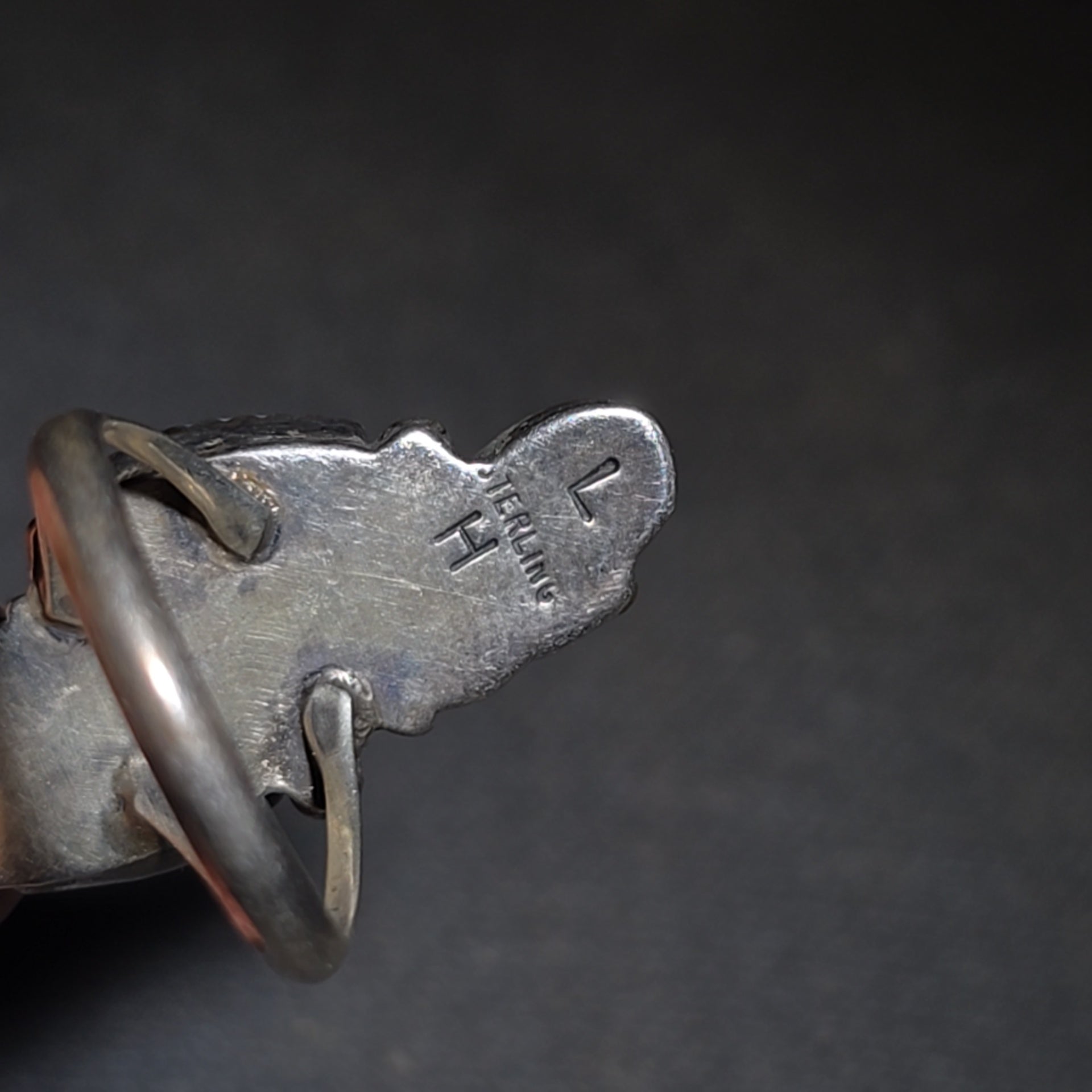 Grouping of Five Vintage Navajo Silver and Mother of Pearl Rings including a Four-Stone Ring by Les Hill, Sizes four through Seven