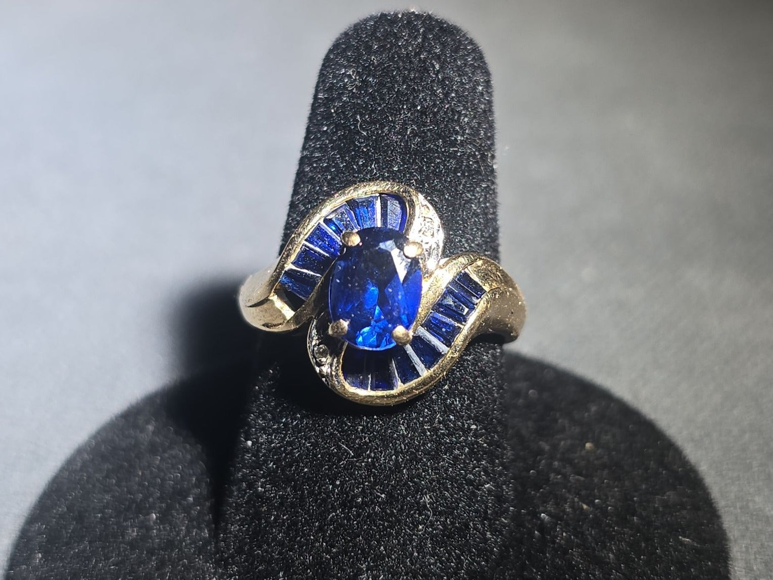10K Gold Oval-Cut Sapphire and Diamond Bypass Ring with Baguette-Cut Sapphires