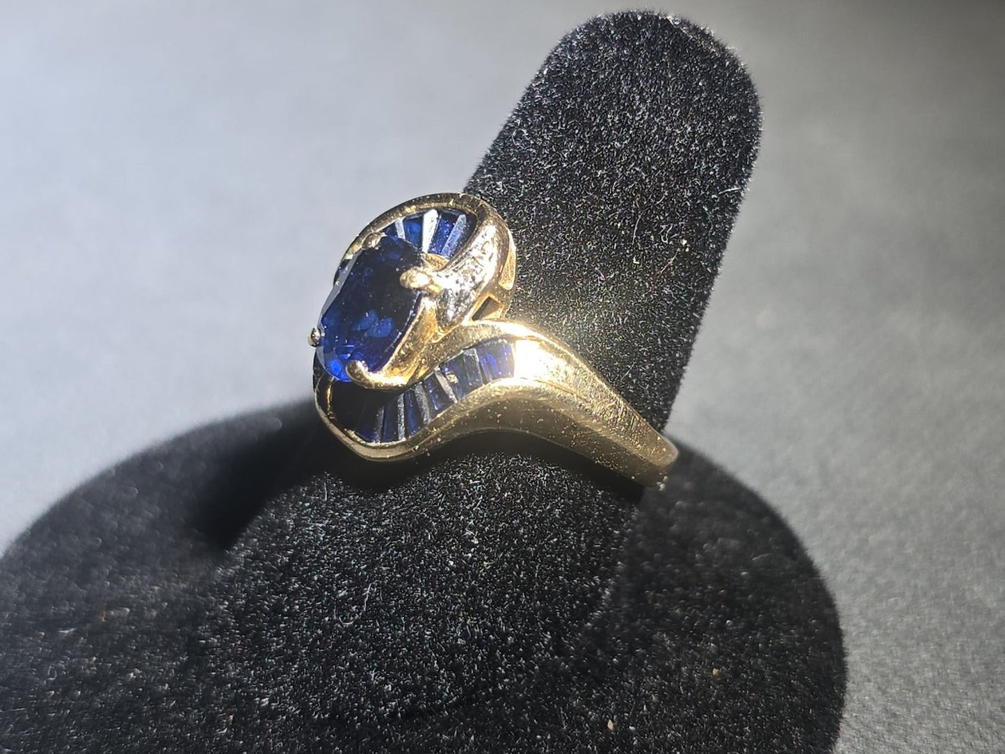 10K Gold Oval-Cut Sapphire and Diamond Bypass Ring with Baguette-Cut Sapphires