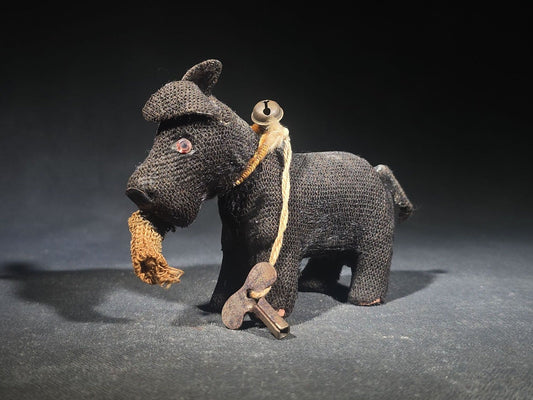 Antique Black Fabric-Covered Wind-Up Dog Toy with Glass Eyes, Crocheted Muzzle, Bell Collar, and Key