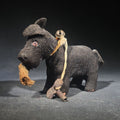 Lot 129 - Antique Black Fabric-Covered Wind-Up Dog Toy with Glass Eyes, Crocheted Muzzle, Bell Collar, and Key