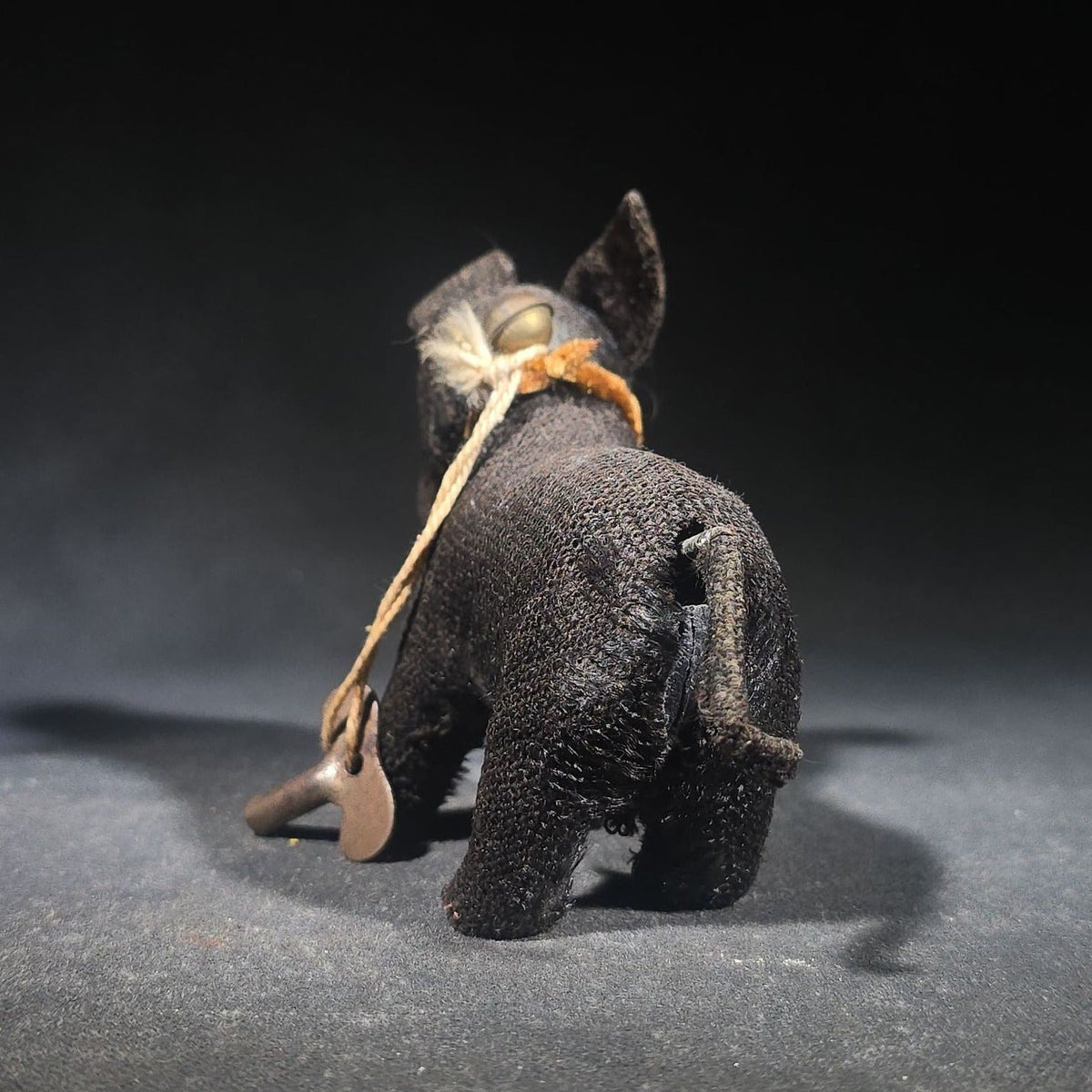 Antique Black Fabric-Covered Wind-Up Dog Toy with Glass Eyes, Crocheted Muzzle, Bell Collar, and Key