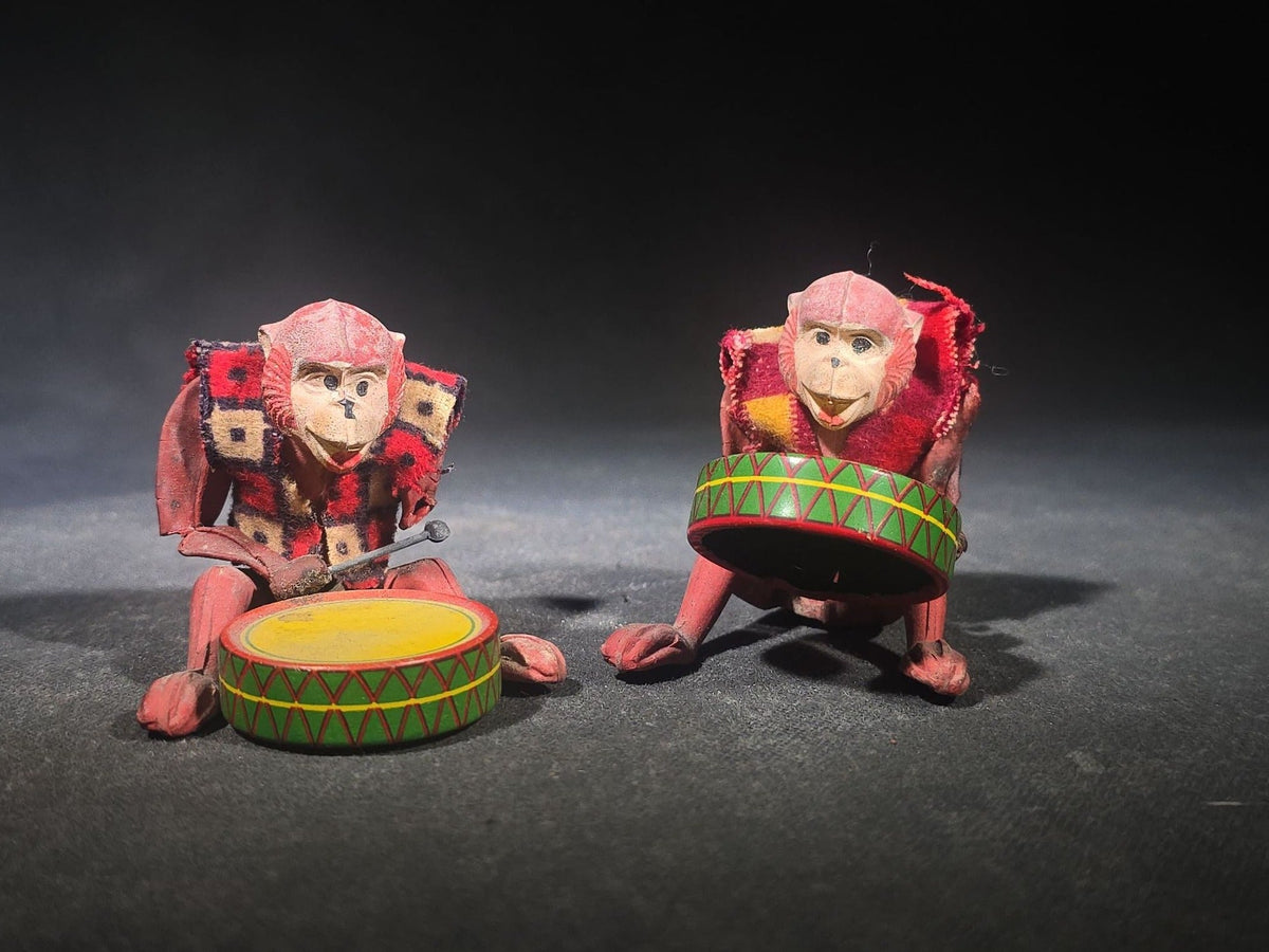 Pair of Vintage Rubber and Tin Lithograph Drumming Monkey Toys with Fabric Jackets, Note Missing Arm, Splits in Rubber
