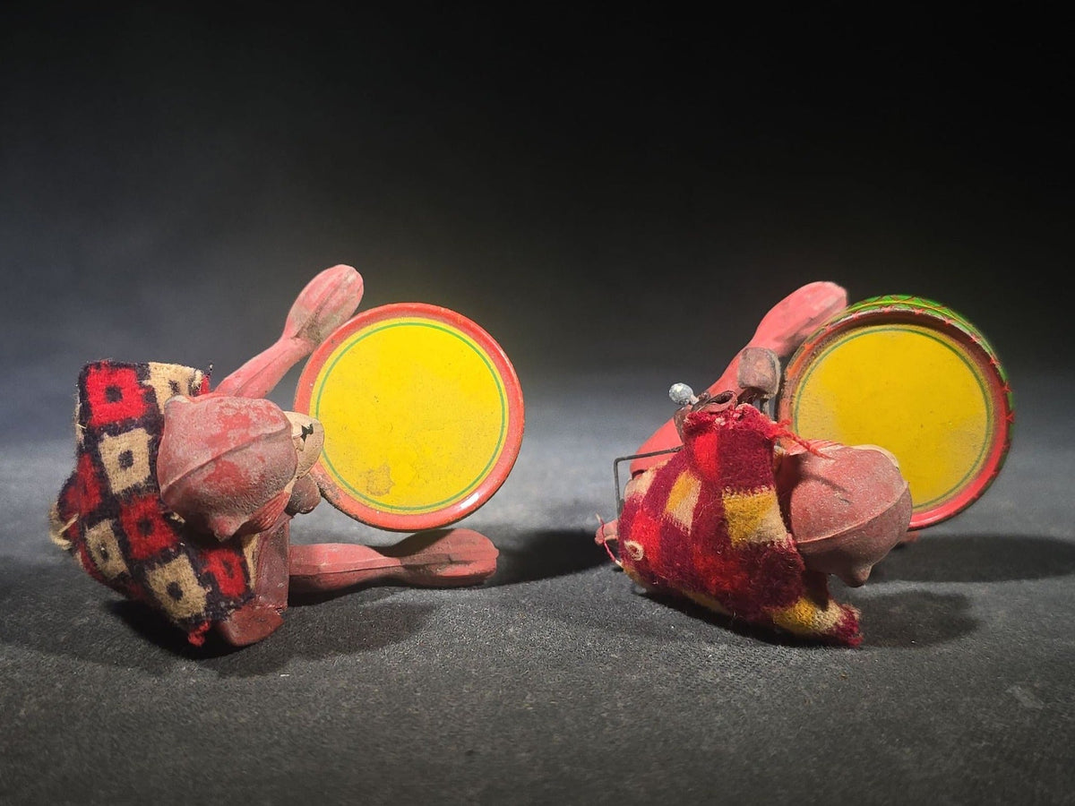 Pair of Vintage Rubber and Tin Lithograph Drumming Monkey Toys with Fabric Jackets, Note Missing Arm, Splits in Rubber