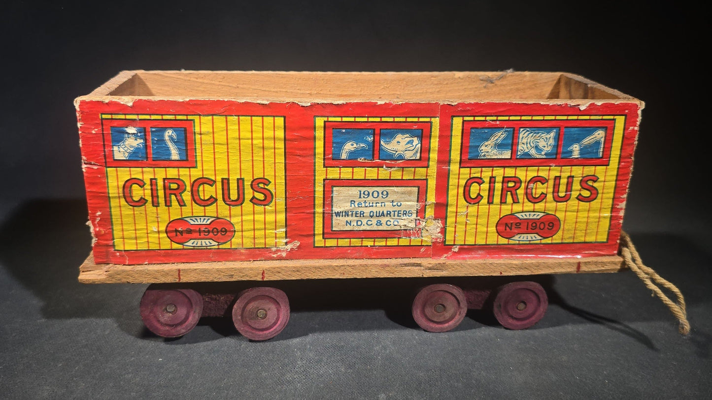 Antique N.D.C. & Co. Wooden Circus Car No. 1909 Pull Toy with Paper Lithograph Graphics and Eight Wooden Animal Figures, Note Missing One Wheel