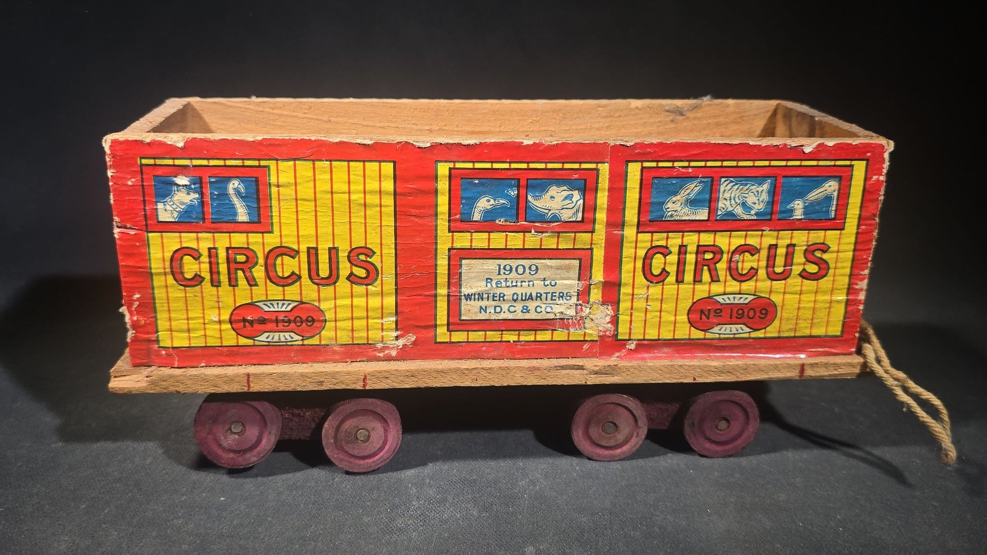 Antique N.D.C. & Co. Wooden Circus Car No. 1909 Pull Toy with Paper Lithograph Graphics and Eight Wooden Animal Figures, Note Missing One Wheel