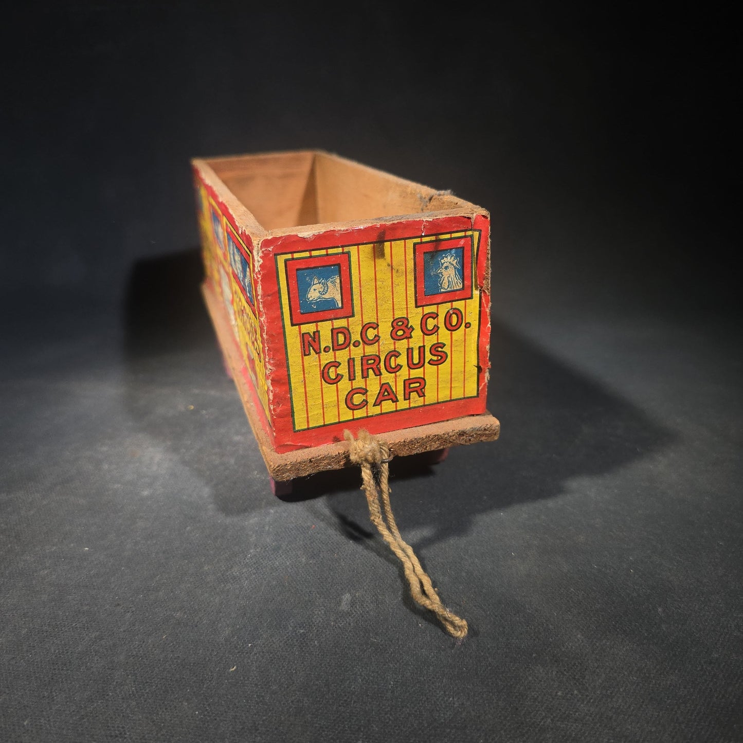 Antique N.D.C. & Co. Wooden Circus Car No. 1909 Pull Toy with Paper Lithograph Graphics and Eight Wooden Animal Figures, Note Missing One Wheel