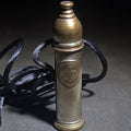 Lot 052 - Antique Brass Nanny Bubble Blower with Crown Emblem, Cork Stopper, Wire Loop Wand, and Lanyard, 2-3/4" H