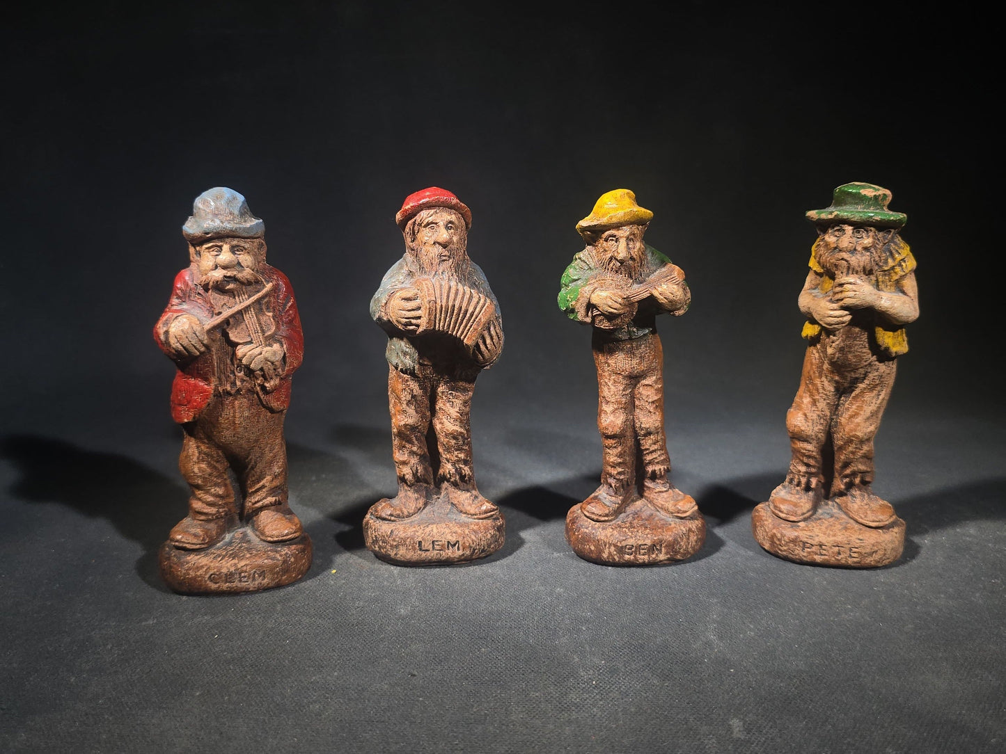 Grouping of Four Vintage Painted Hillbilly Band Musician Figurines including Clem, Lem, Ben, and Pete, Manufactured by Multi Products Inc., Chicago, Illinois, 1942