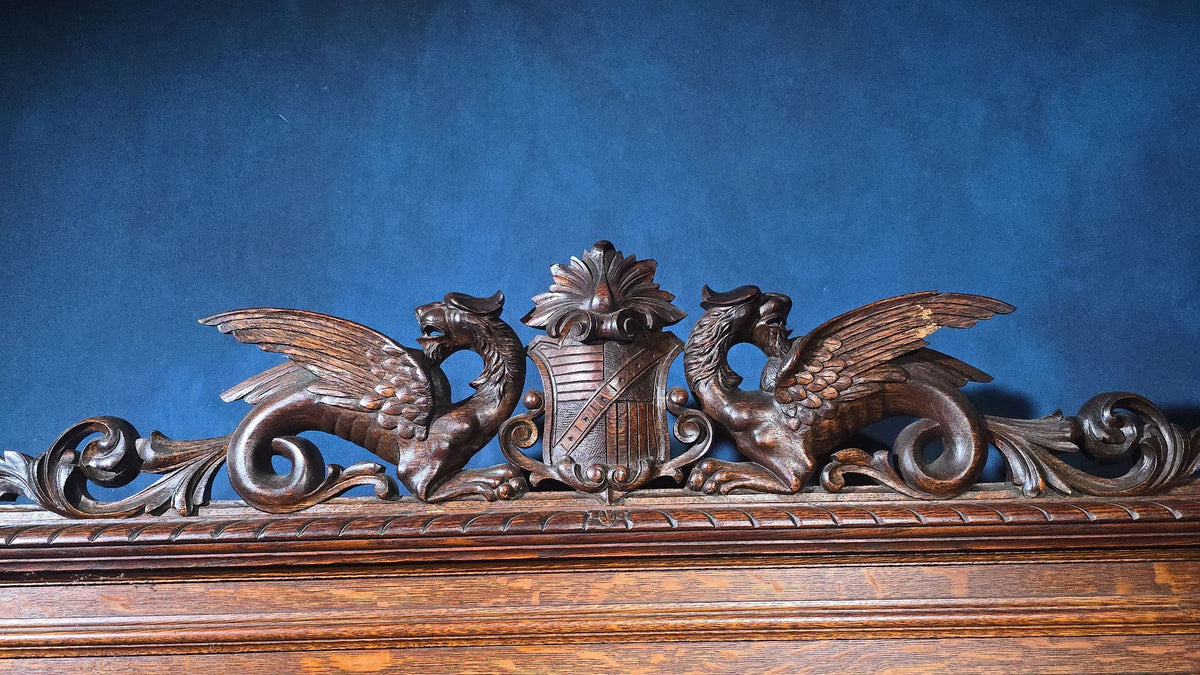 Antique Renaissance Revival Carved Oak Hall Bench with Lift-Top Storage, Green Man, Griffin and Shield Crest