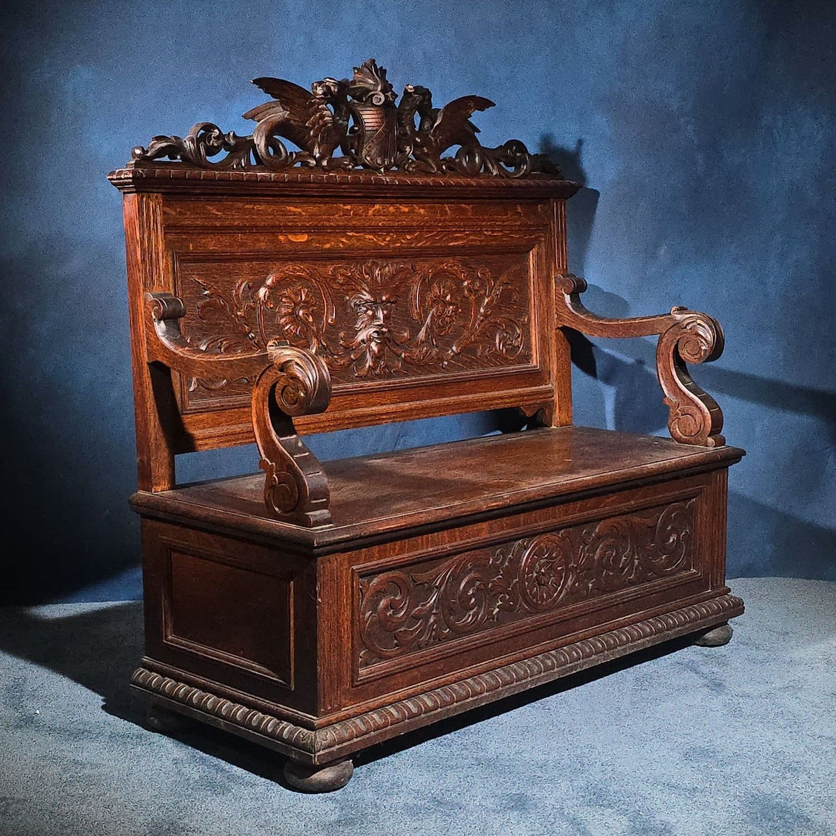 Antique Renaissance Revival Carved Oak Hall Bench with Lift-Top Storage, Green Man, Griffin and Shield Crest