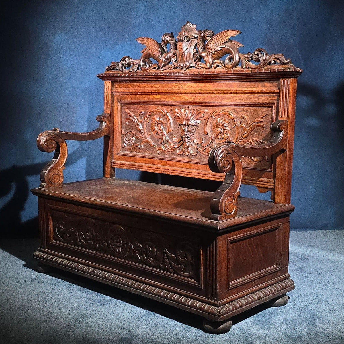 Antique Renaissance Revival Carved Oak Hall Bench with Lift-Top Storage, Green Man, Griffin and Shield Crest