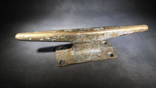 Vintage Bronze Boat Dock Cleat with Layers of Old Paint
