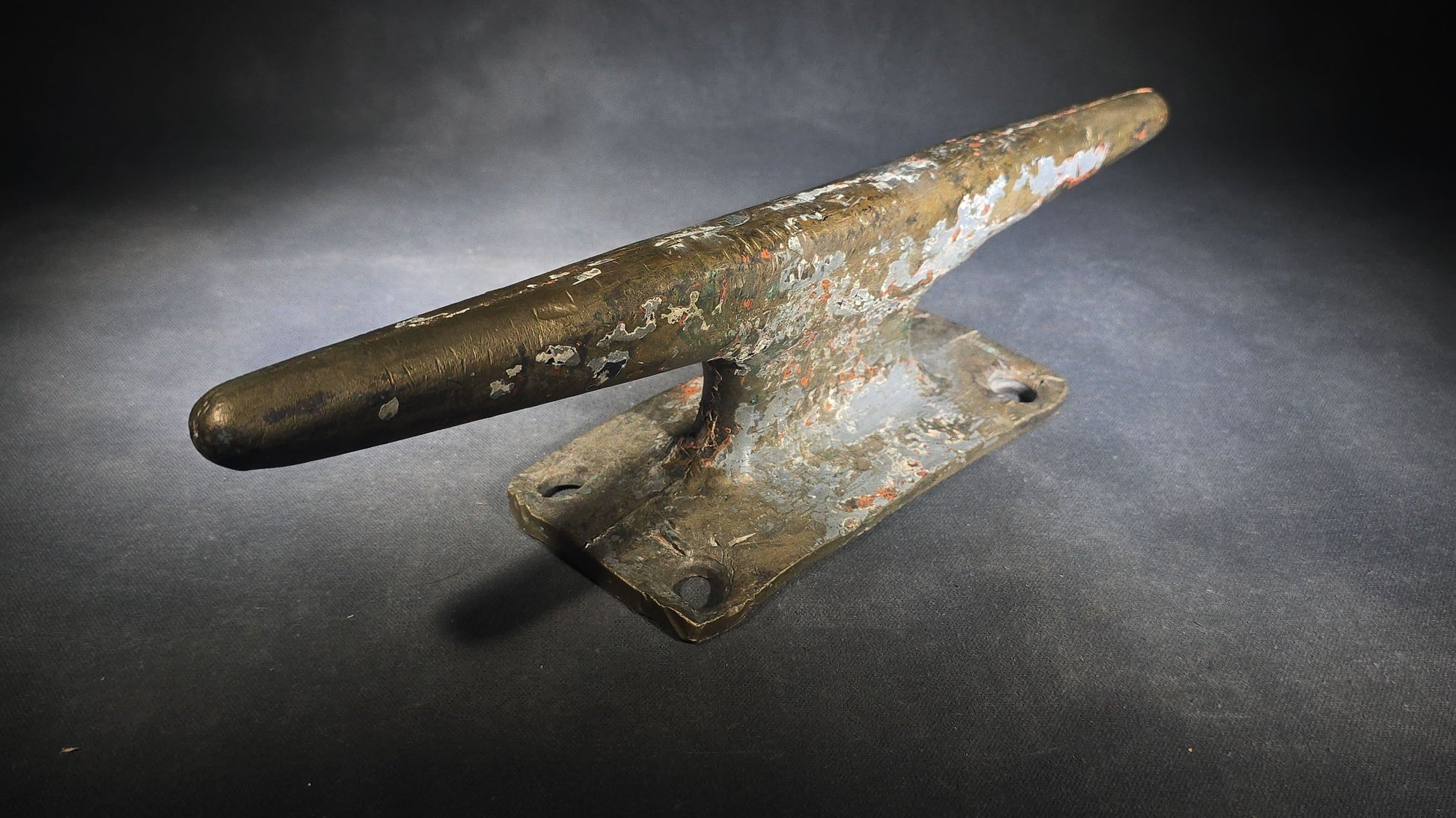 Vintage Bronze Boat Dock Cleat with Layers of Old Paint