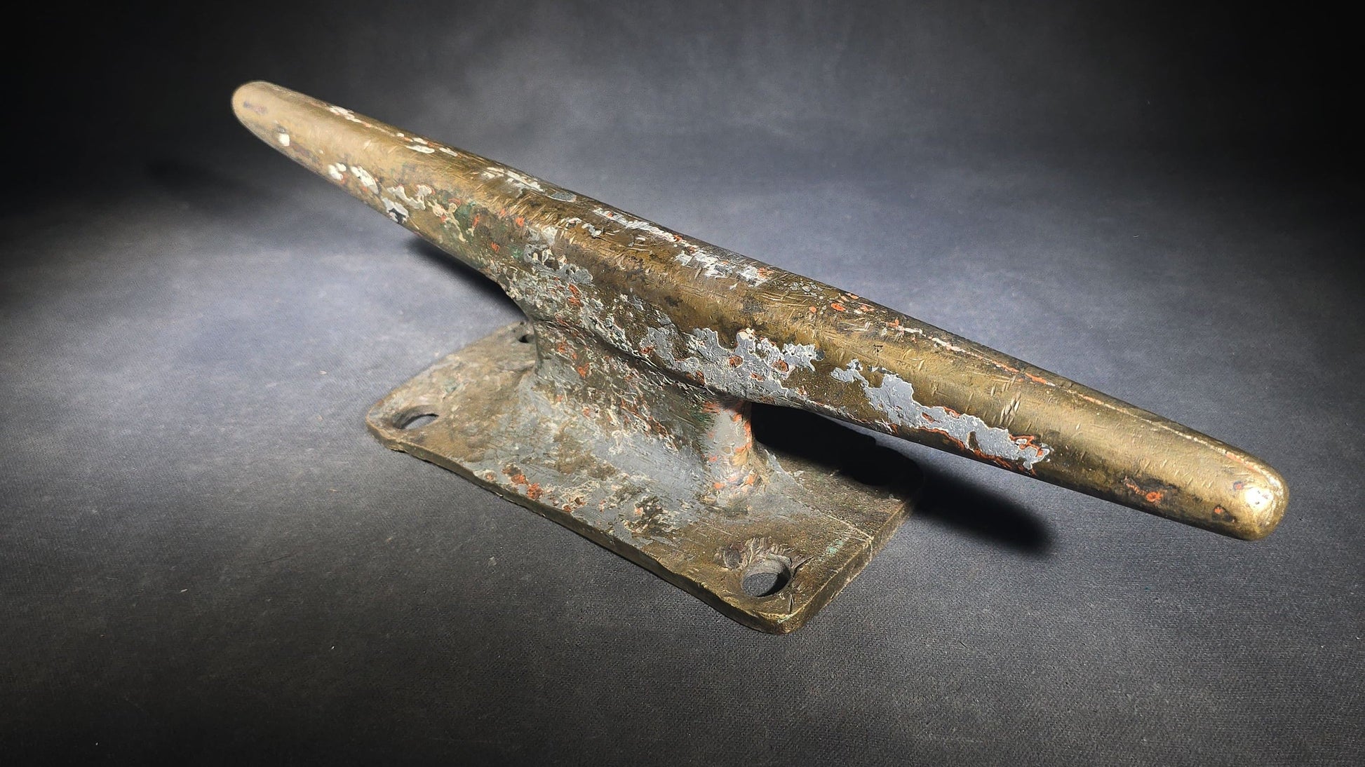 Vintage Bronze Boat Dock Cleat with Layers of Old Paint