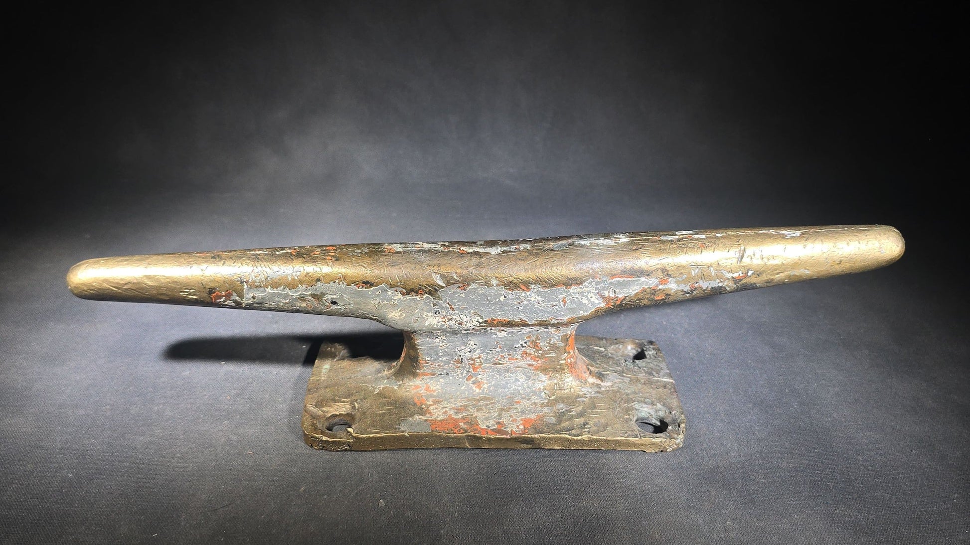 Vintage Bronze Boat Dock Cleat with Layers of Old Paint