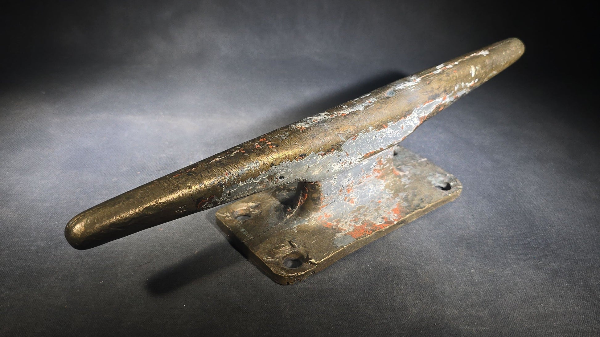 Vintage Bronze Boat Dock Cleat with Layers of Old Paint